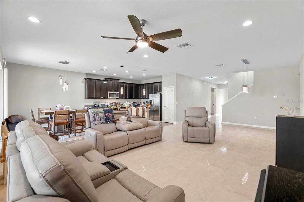 18565 Obregan Drive Spring Hill, FL 34610 - Photo 14 of 70 a living room with furniture and kitchen view
