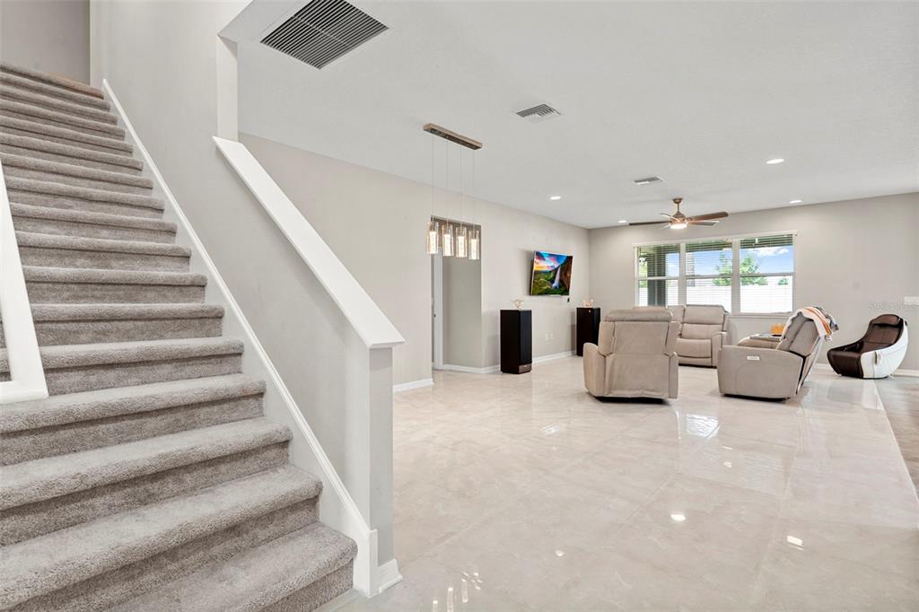 18565 Obregan Drive Spring Hill, FL 34610 - Photo 16 of 70 a living room with furniture and a chandelier