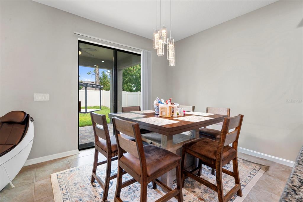 18565 Obregan Drive Spring Hill, FL 34610 - Photo 21 of 70 a dining room with furniture and window