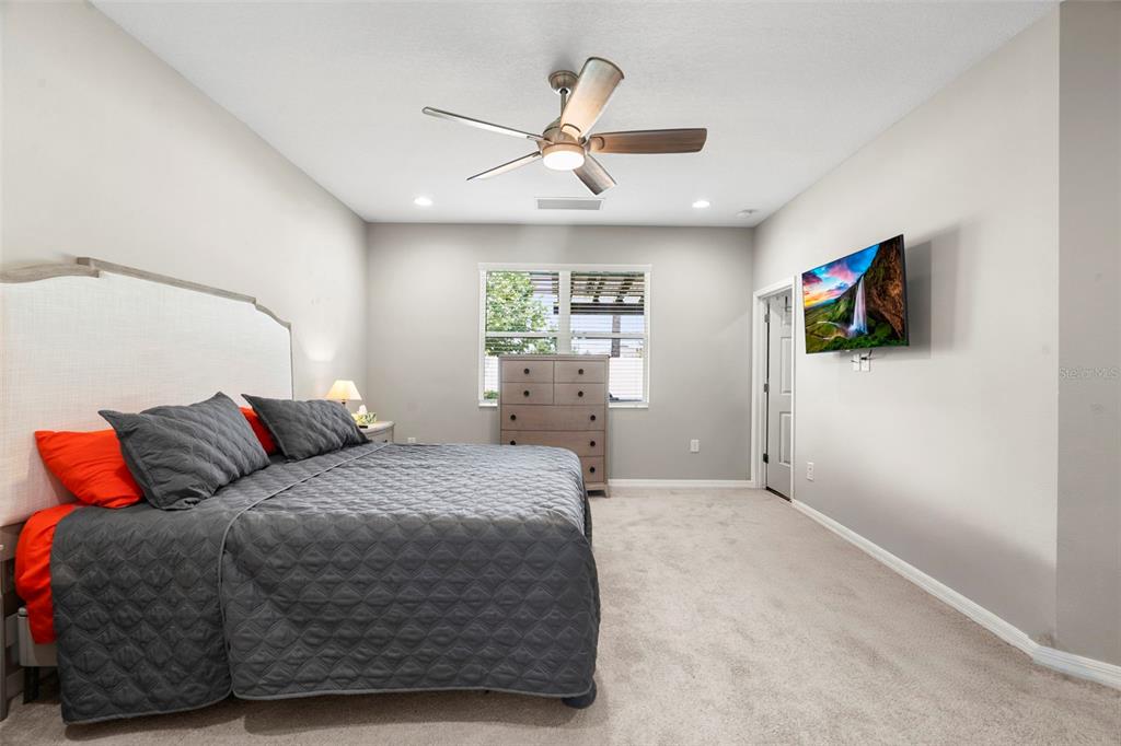 18565 Obregan Drive Spring Hill, FL 34610 - Photo 26 of 70 a bedroom with a bed and a flat screen tv