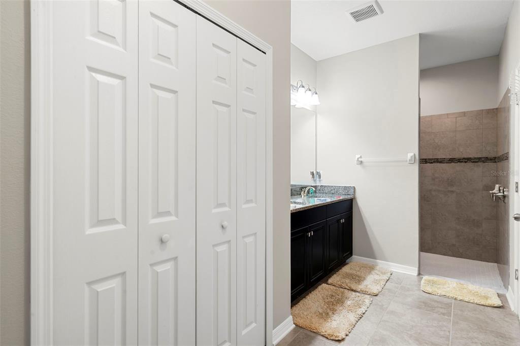 18565 Obregan Drive Spring Hill, FL 34610 - Photo 29 of 70 a bathroom with a sink and a mirror