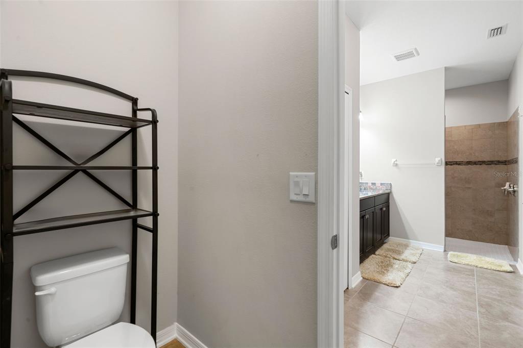 18565 Obregan Drive Spring Hill, FL 34610 - Photo 31 of 70 a bathroom with a toilet and a shower