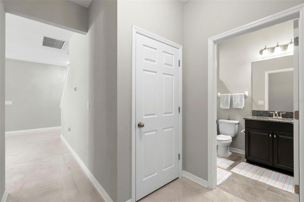 18565 Obregan Drive Spring Hill, FL 34610 - Photo 35 of 70 a spacious bathroom with a granite countertop toilet a sink and a mirror