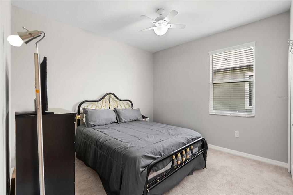 18565 Obregan Drive Spring Hill, FL 34610 - Photo 37 of 70 a bedroom with a bed dresser and a window