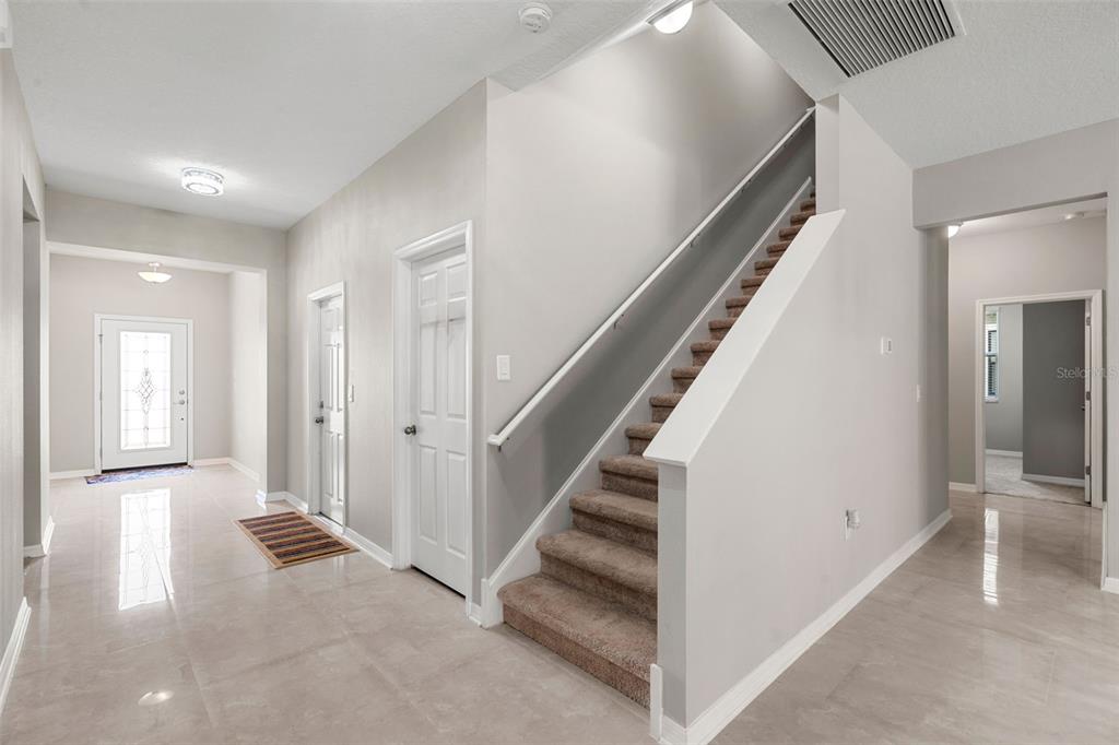 18565 Obregan Drive Spring Hill, FL 34610 - Photo 39 of 70 a view of a hallway with staircase