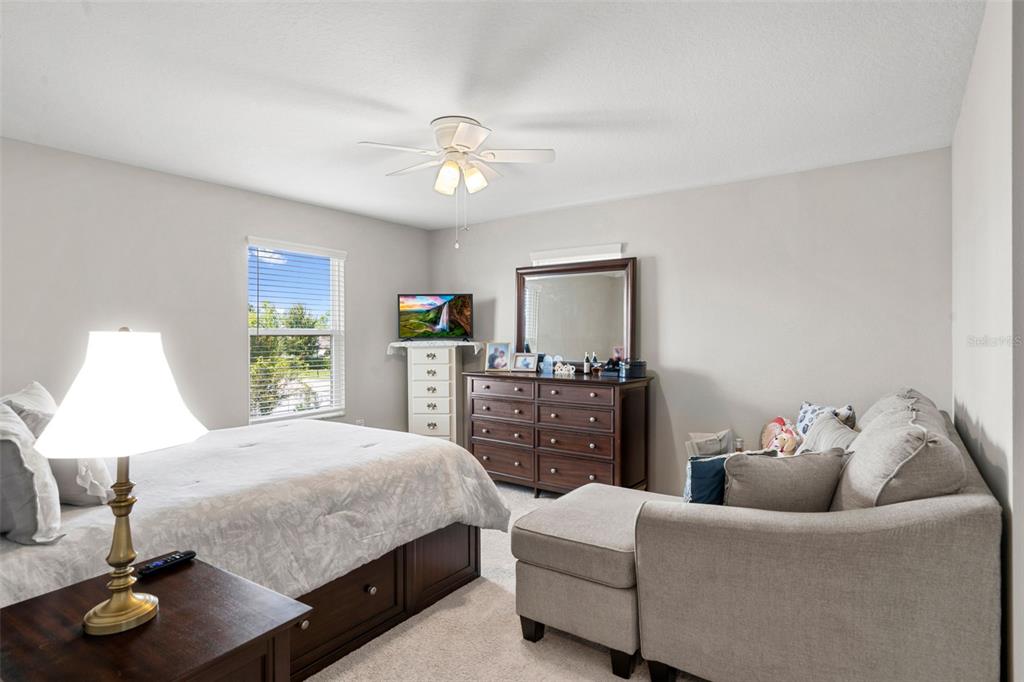 18565 Obregan Drive Spring Hill, FL 34610 - Photo 43 of 70 a bedroom with a bed and wooden floor