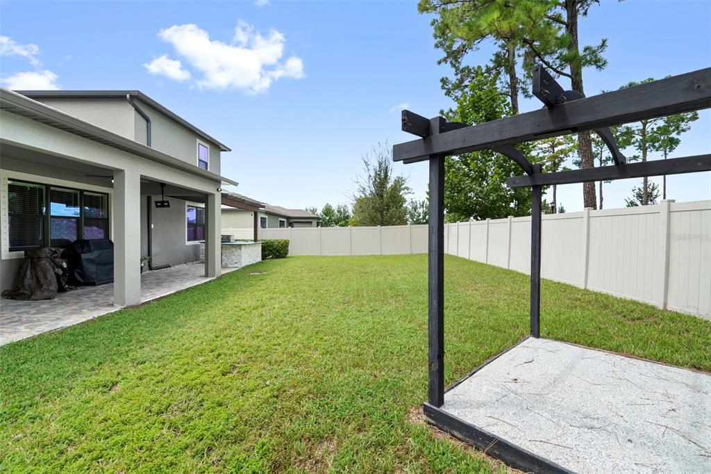 18565 Obregan Drive Spring Hill, FL 34610 - Photo 52 of 70 a view of a backyard with a garden