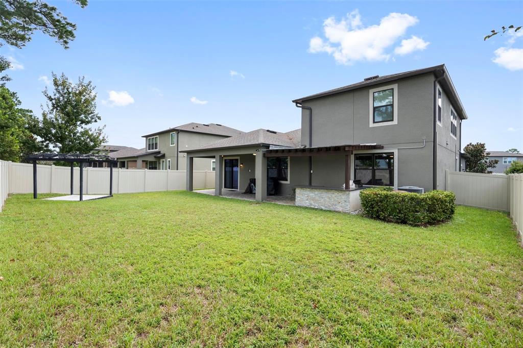 18565 Obregan Drive Spring Hill, FL 34610 - Photo 55 of 70 a view of a house with a yard and sitting area