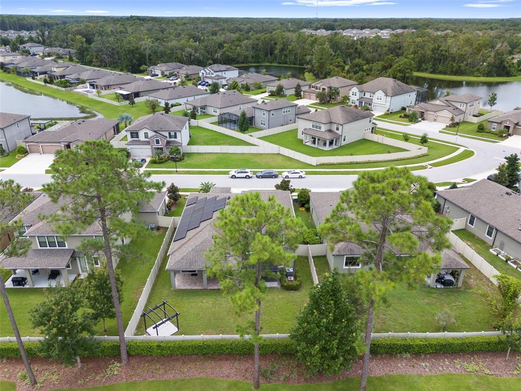 18565 Obregan Drive Spring Hill, FL 34610 - Photo 62 of 70 an aerial view of a house with a yard basket ball court and outdoor seating