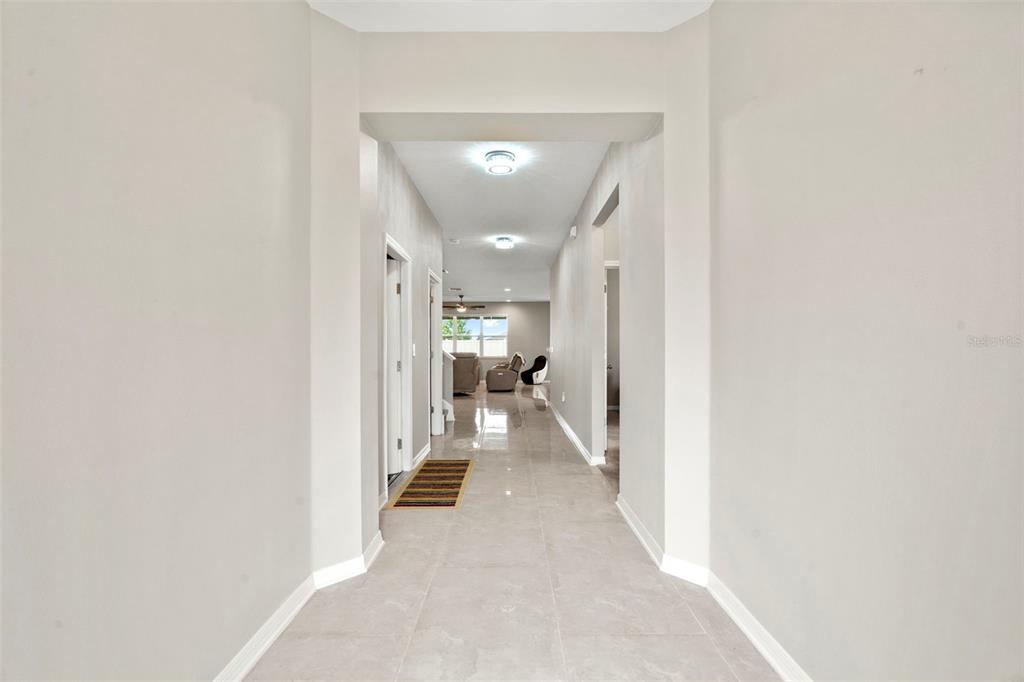 18565 Obregan Drive Spring Hill, FL 34610 - Photo 10 of 70 a view of a hallway with a white walls