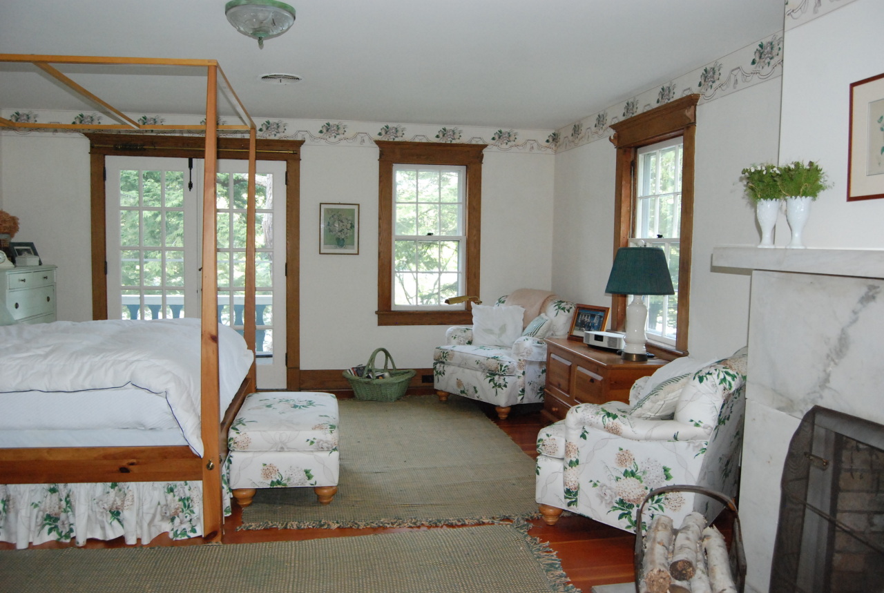 55 Eaton Road Monterey, MA 01245 - Photo 18 of 48 a living room with furniture large window and a flat screen tv