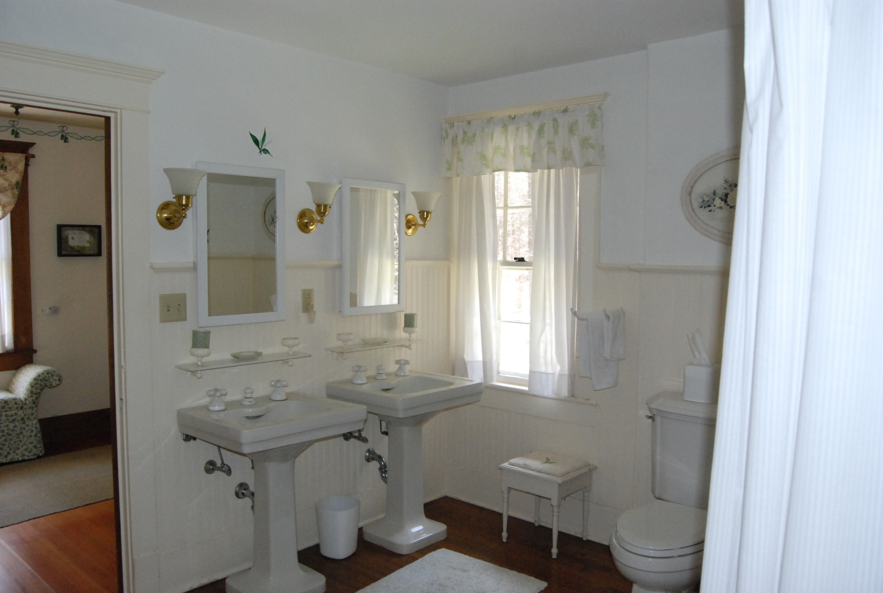 55 Eaton Road Monterey, MA 01245 - Photo 21 of 48 a bathroom with a sink toilet a mirror and shower