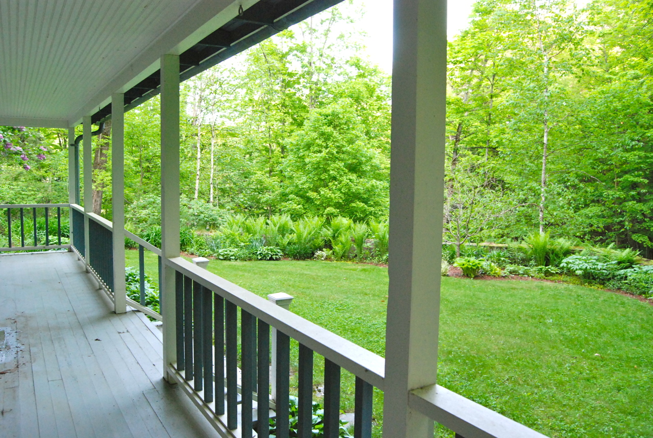 55 Eaton Road Monterey, MA 01245 - Photo 34 of 48 a view of a porch with a yard
