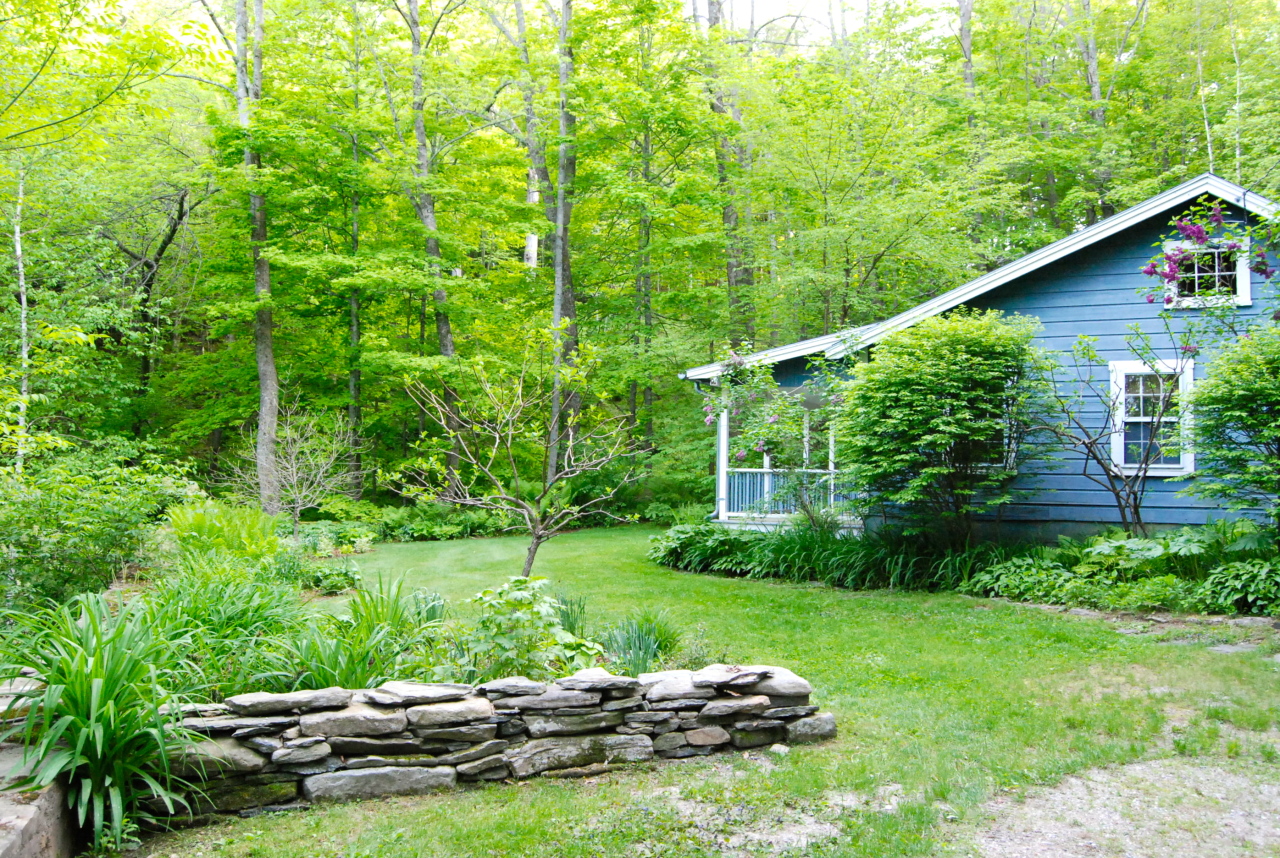 55 Eaton Road Monterey, MA 01245 - Photo 35 of 48 a view of a backyard with plants and a garden