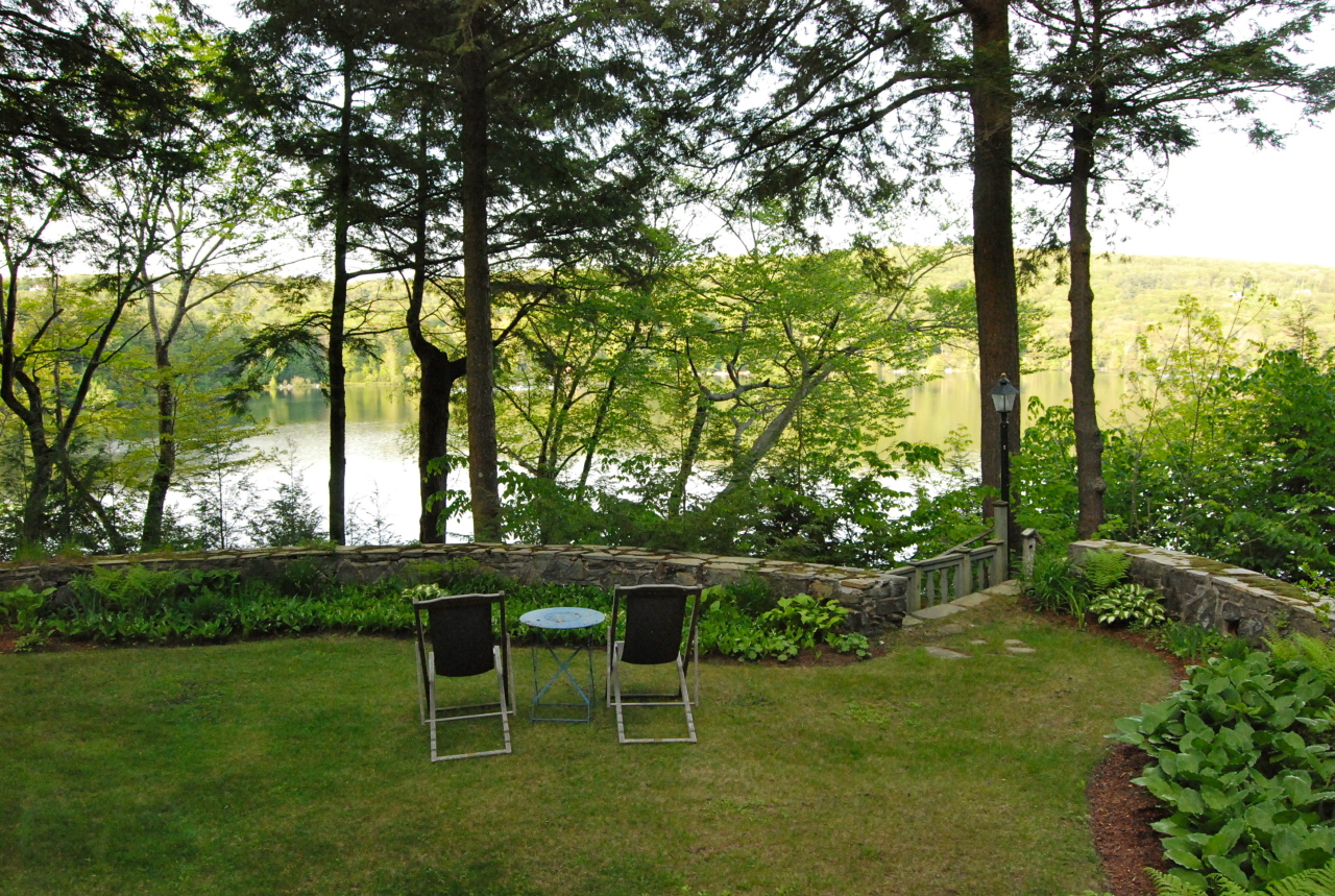 55 Eaton Road Monterey, MA 01245 - Photo 39 of 48 a view of a table and chairs in the garden