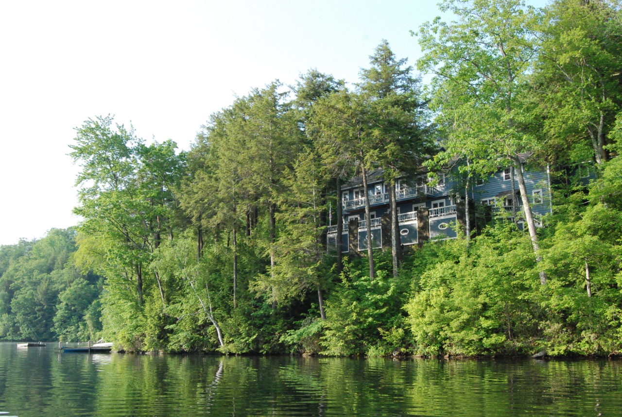 55 Eaton Road Monterey, MA 01245 - Photo 45 of 48 a view of a lake with a house in the background