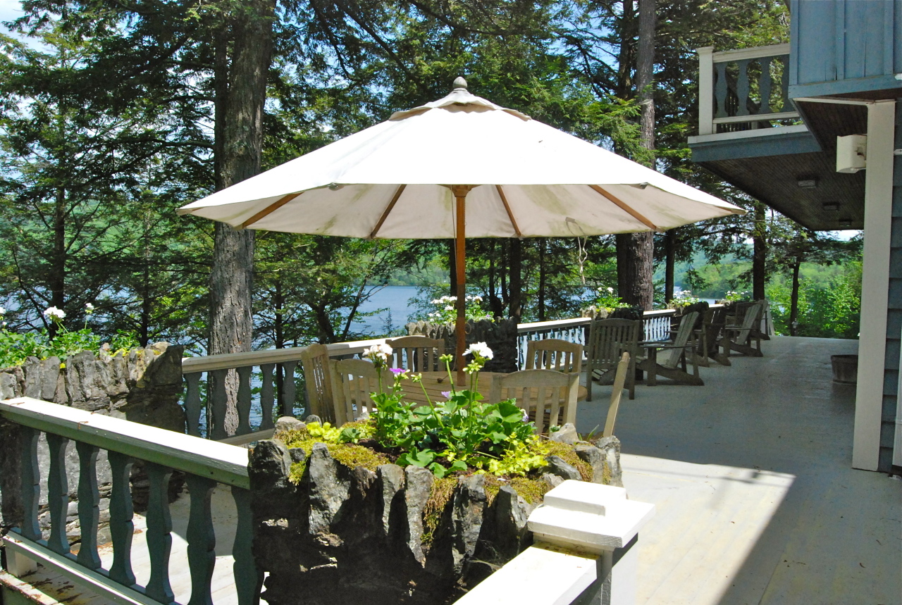 55 Eaton Road Monterey, MA 01245 - Photo 7 of 48 a view of a patio with furniture and a garden