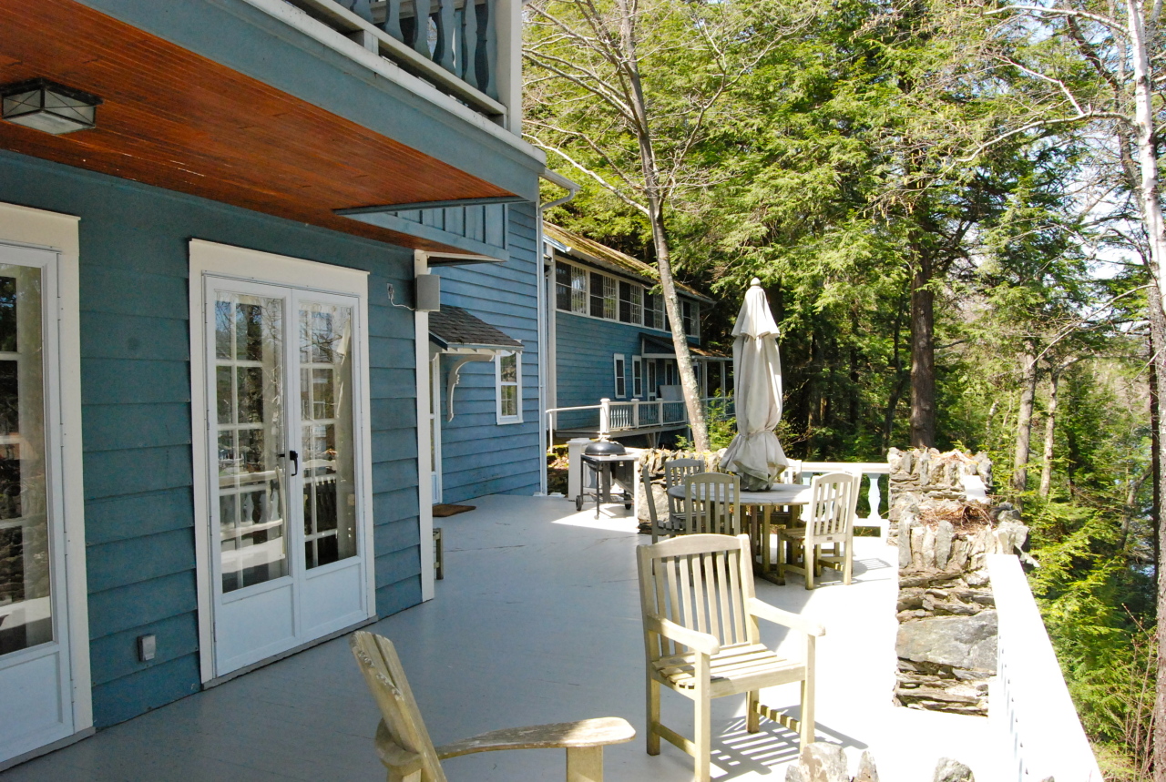 55 Eaton Road Monterey, MA 01245 - Photo 8 of 48 a view of a patio with couches table and chairs and potted plants