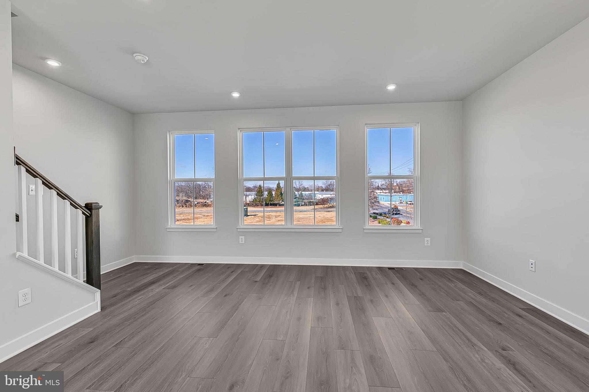 33 B Oasis Avenue Ranson, WV 25438 - Photo 20 of 38 a room with wooden floors and view kitchen