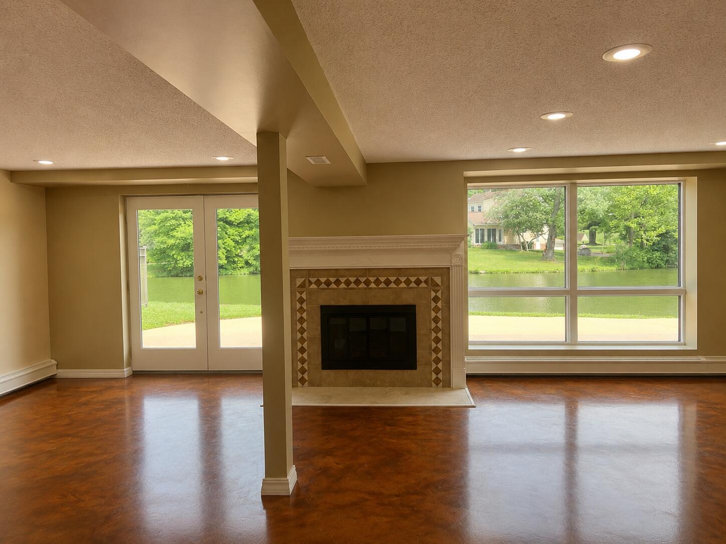 2612 Amsterdam Road Villa Hills, KY 41017 - Photo 38 of 52 FAMILY ROOM FEATURING CUSTOM OPOXY FLOORS AND A WOODBURNING FIREPLACE - LOCATED IN THE FINISHED WALK-OUT BASEMENT