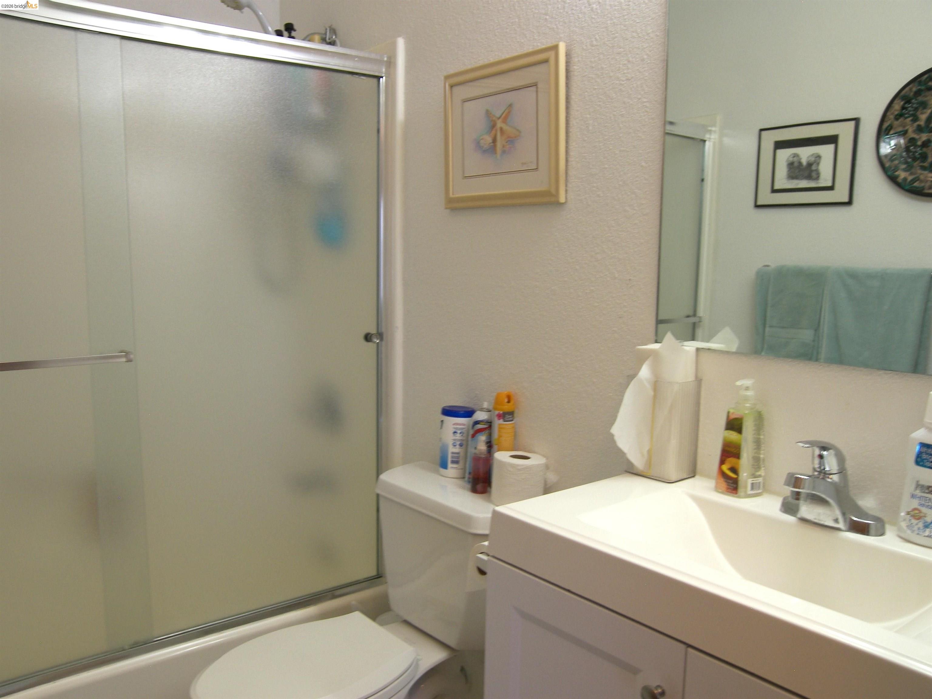 19215 Ferretti Road Groveland, CA 95321 - Photo 12 of 40 Bathroom featuring a white vanity with integrated sink, chrome faucet, and mirrored medicine cabinet