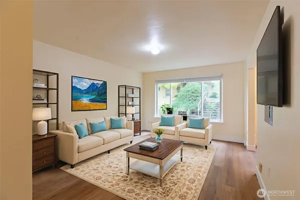 a living room with furniture and a flat screen tv
