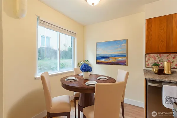 a dining room with furniture and window