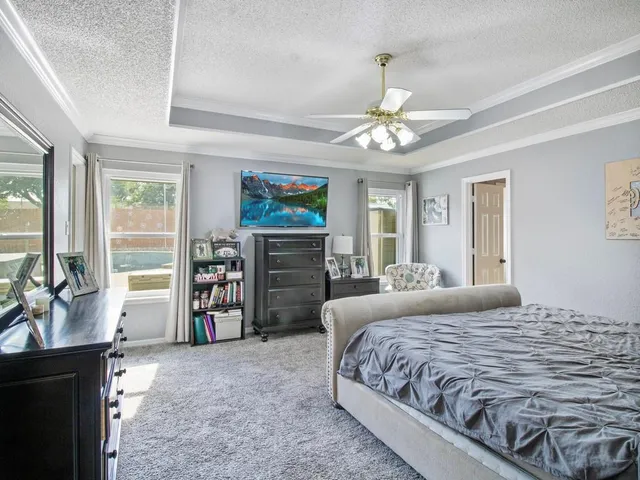 a spacious bathroom with a tub shower and sink