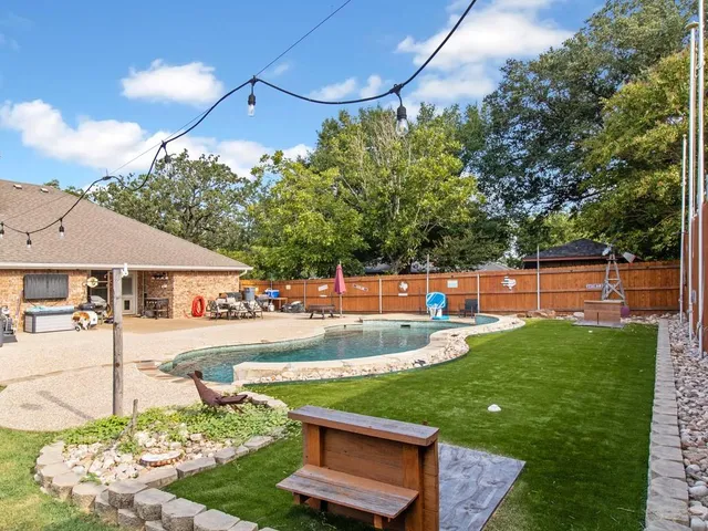 a front view of a house with swimming pool