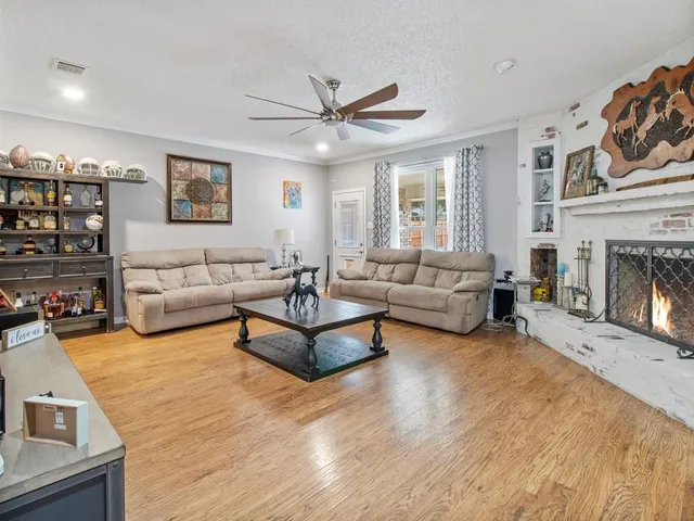 a kitchen with a sink window and cabinets