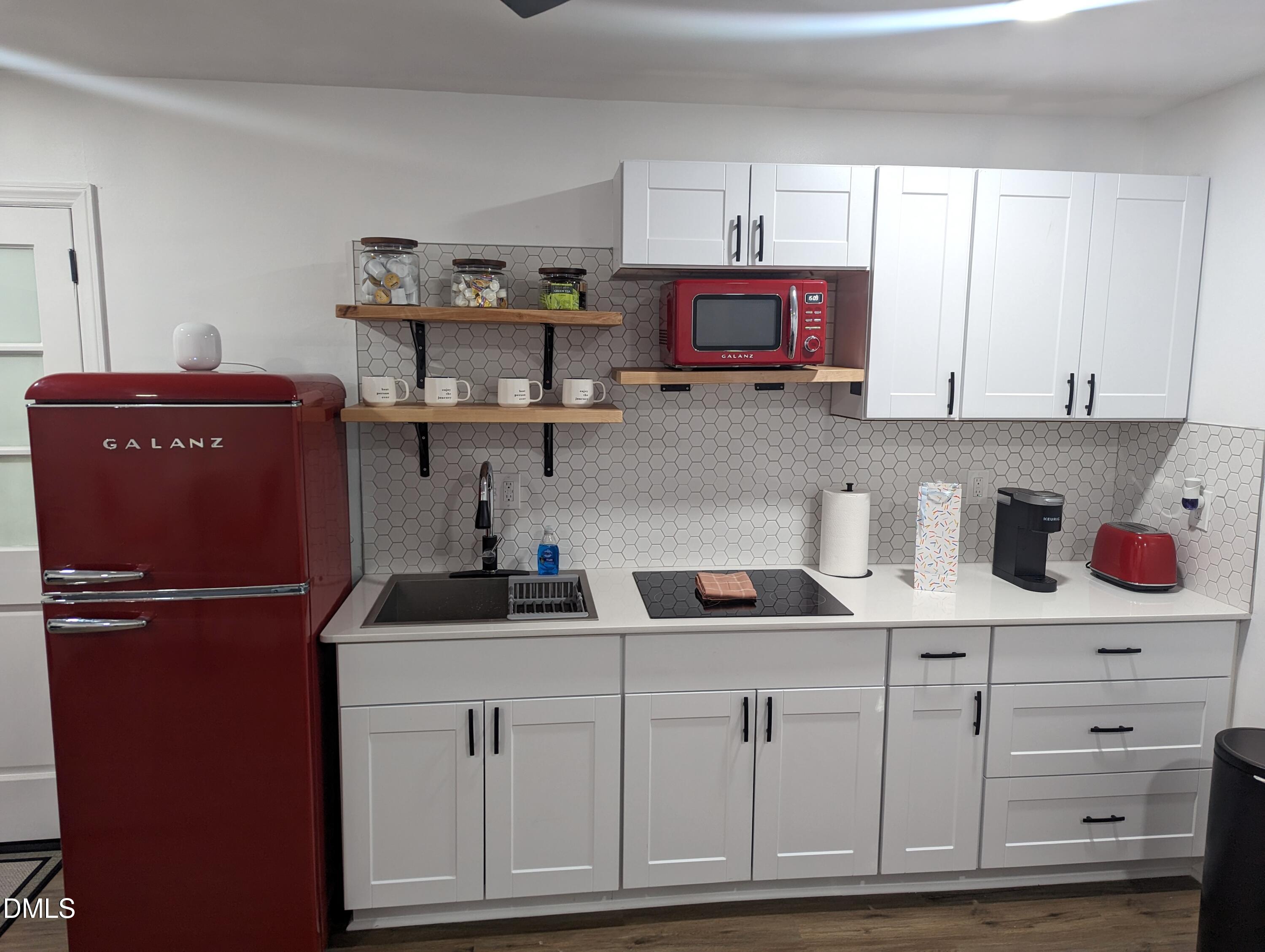 4816 Whitehall Avenue Raleigh, NC 27604 - Photo 18 of 23 a kitchen with cabinets appliances and a window