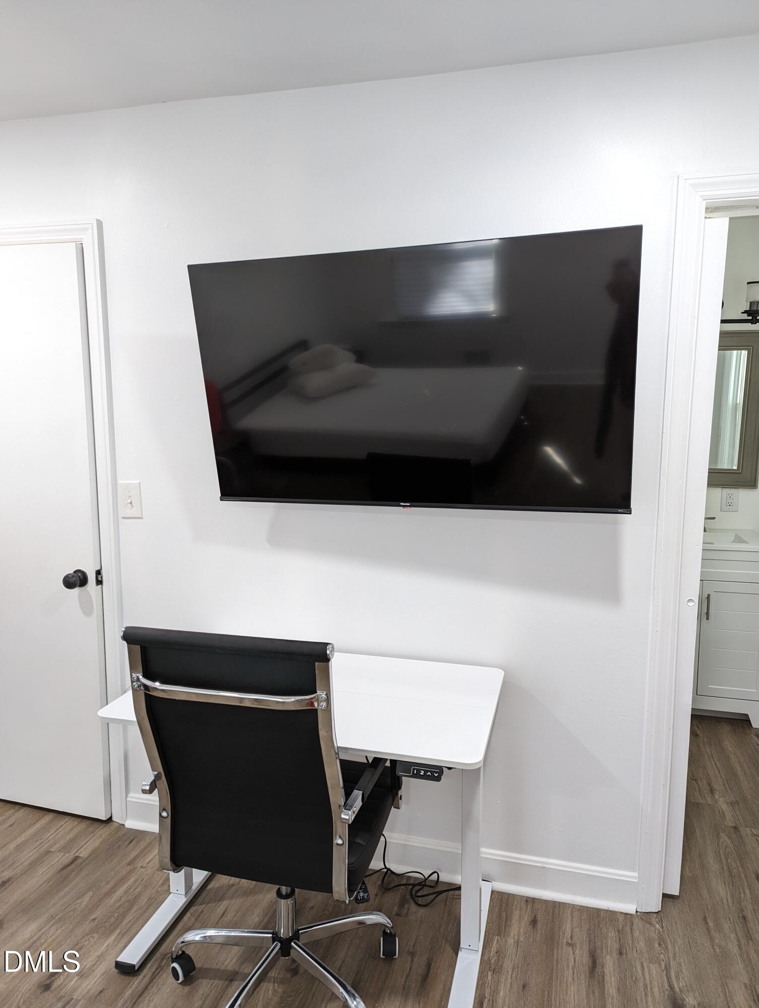 4816 Whitehall Avenue Raleigh, NC 27604 - Photo 20 of 23 a living room with chair and wooden floor