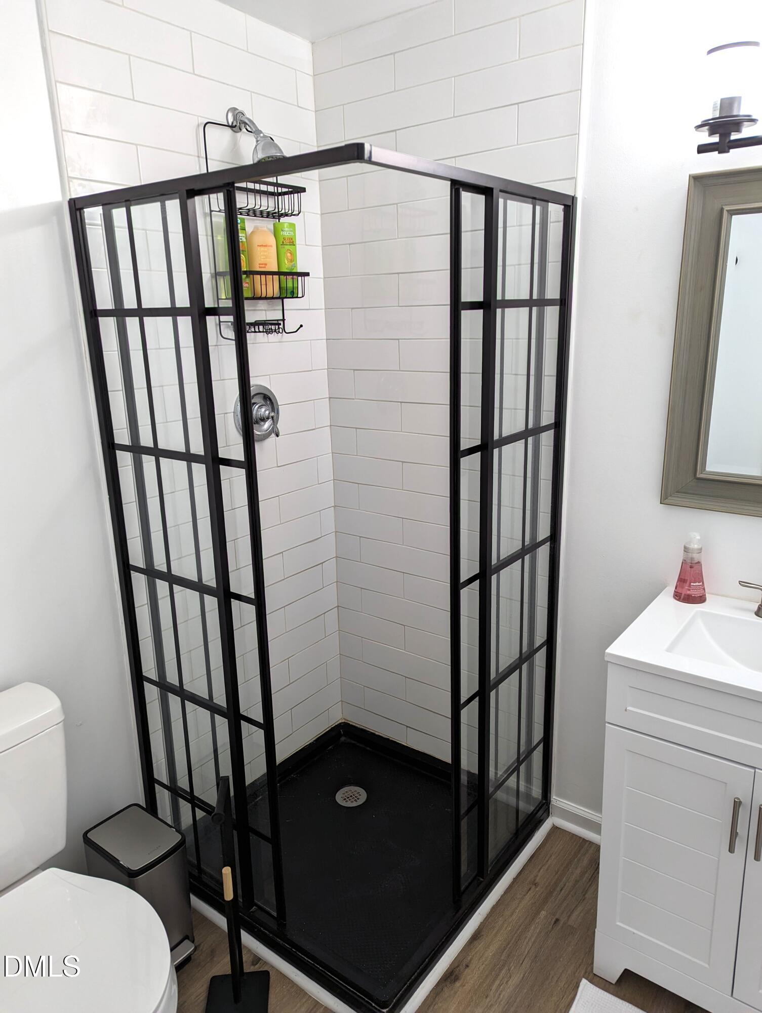 4816 Whitehall Avenue Raleigh, NC 27604 - Photo 21 of 23 a bathroom with a sink toilet and a window
