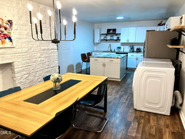 a kitchen with a sink a stove and cabinets