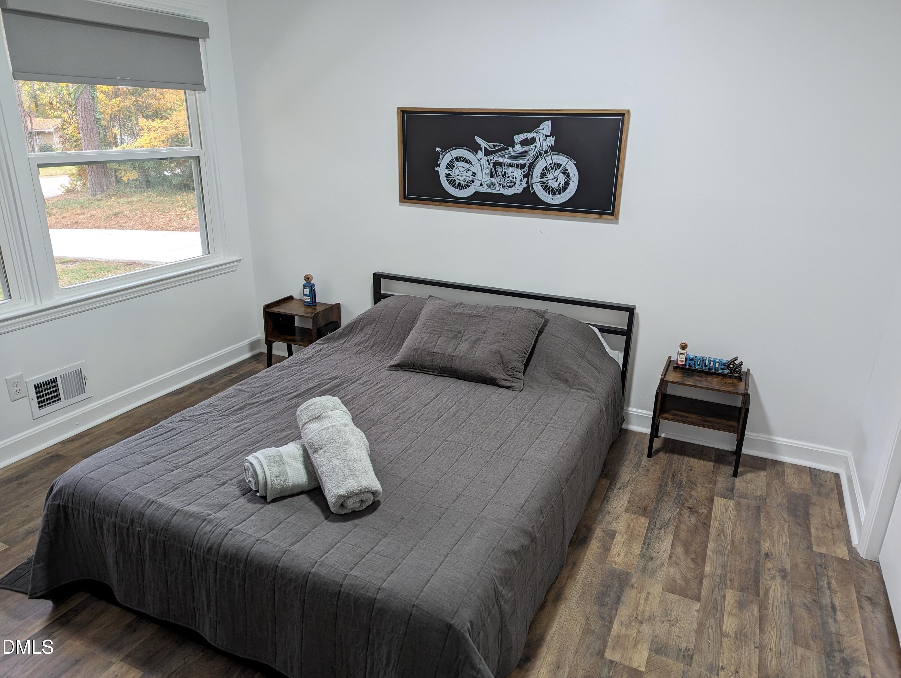 4816 Whitehall Avenue Raleigh, NC 27604 - Photo 7 of 23 a bedroom with a bed and a window