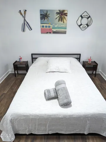 a bedroom with a bed and ceiling fan