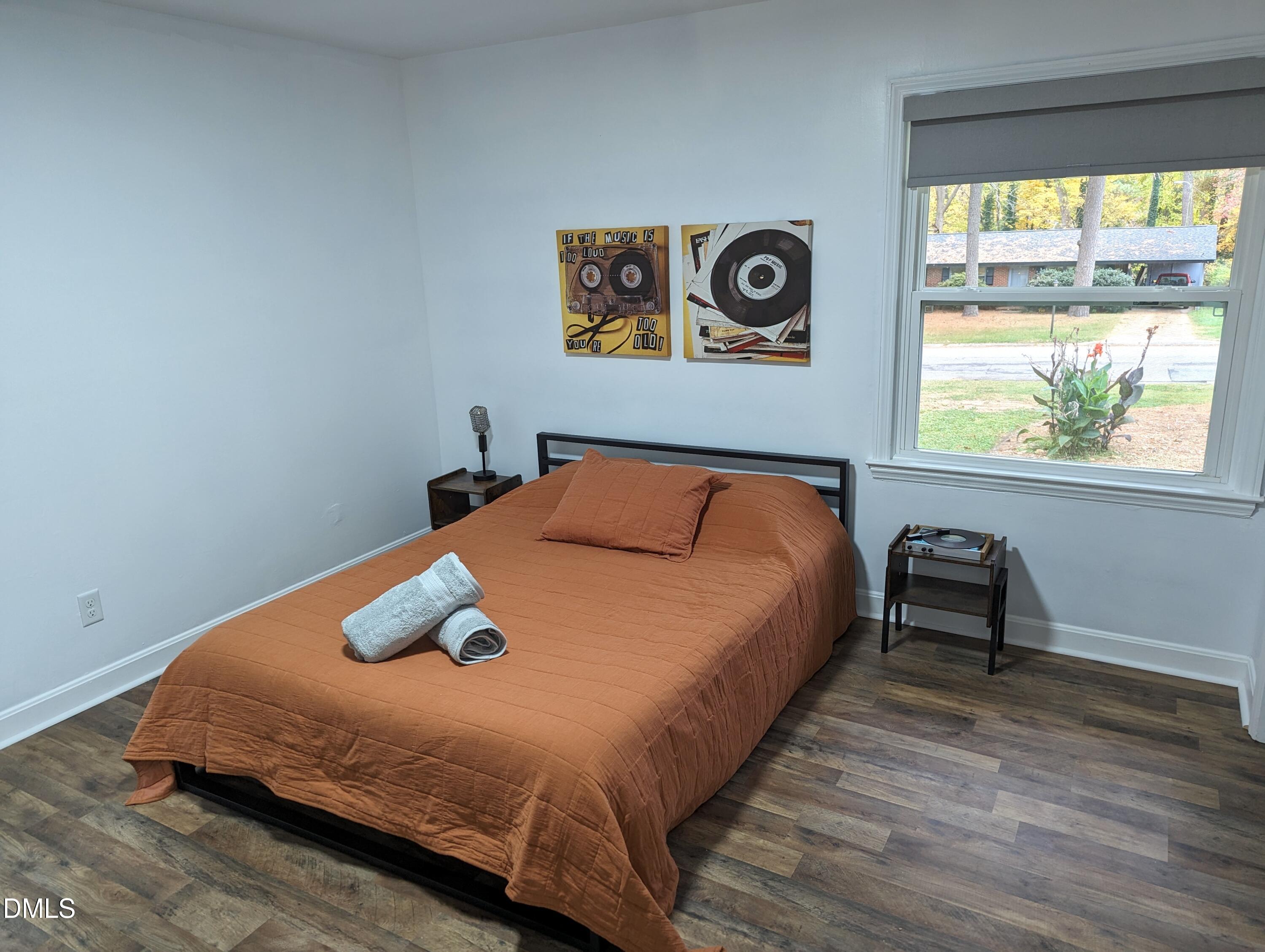 4816 Whitehall Avenue Raleigh, NC 27604 - Photo 9 of 23 a bedroom with a bed and a window
