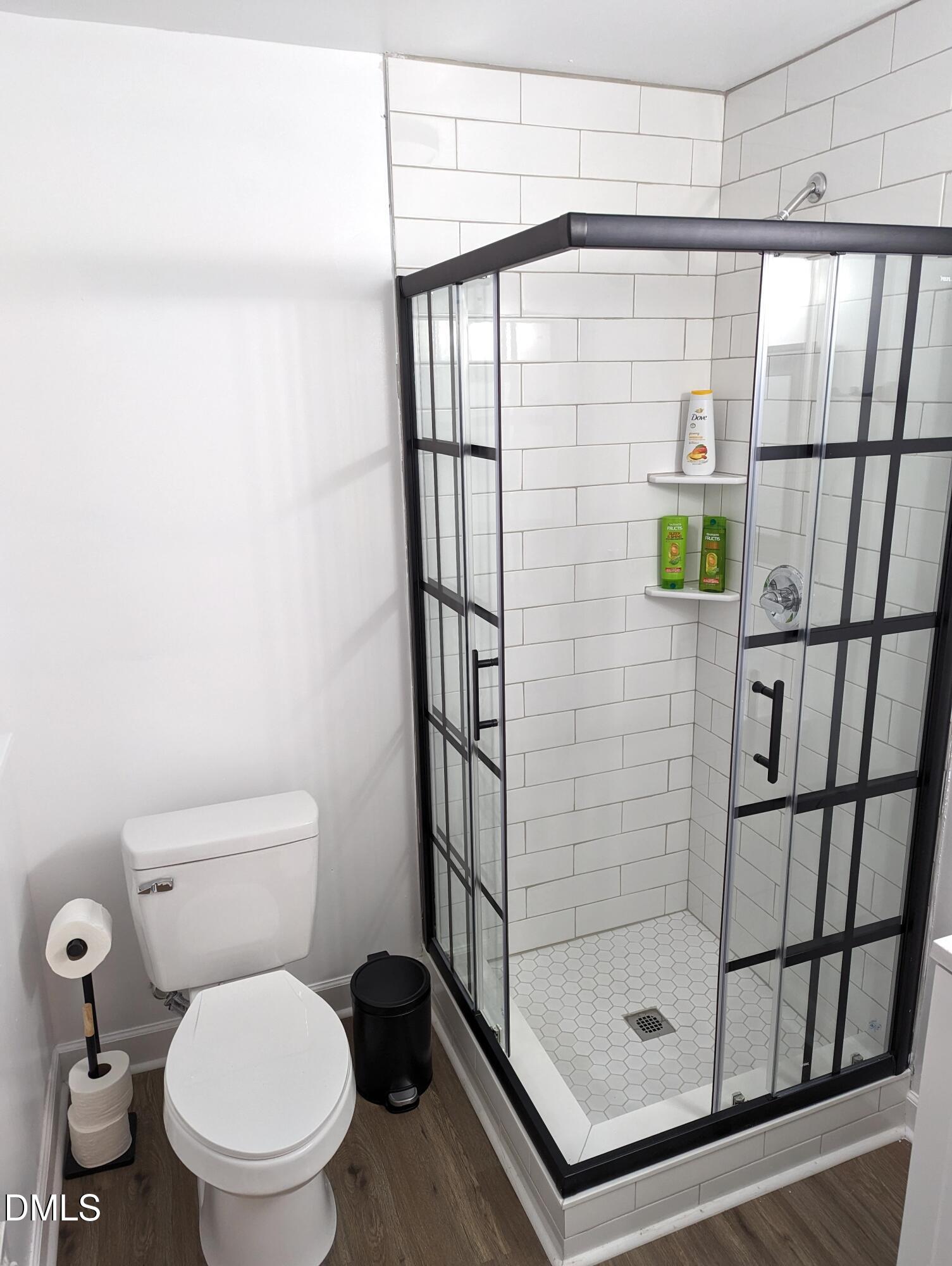 4816 Whitehall Avenue Raleigh, NC 27604 - Photo 10 of 23 a bathroom with a shower and toilet