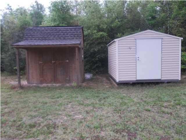 6762 Barnhill Road Milton, FL 32570 - Photo 3 of 6 Shed to the left houses the well.....new shed to the right conveys as well...