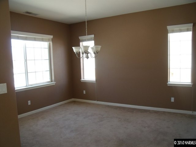 1327 Rouge River Road Fernley, NV 89408 - Photo 2 of 9 an empty room with a window