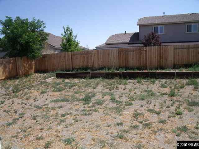 1327 Rouge River Road Fernley, NV 89408 - Photo 8 of 9 a view of outdoor space with wooden fence