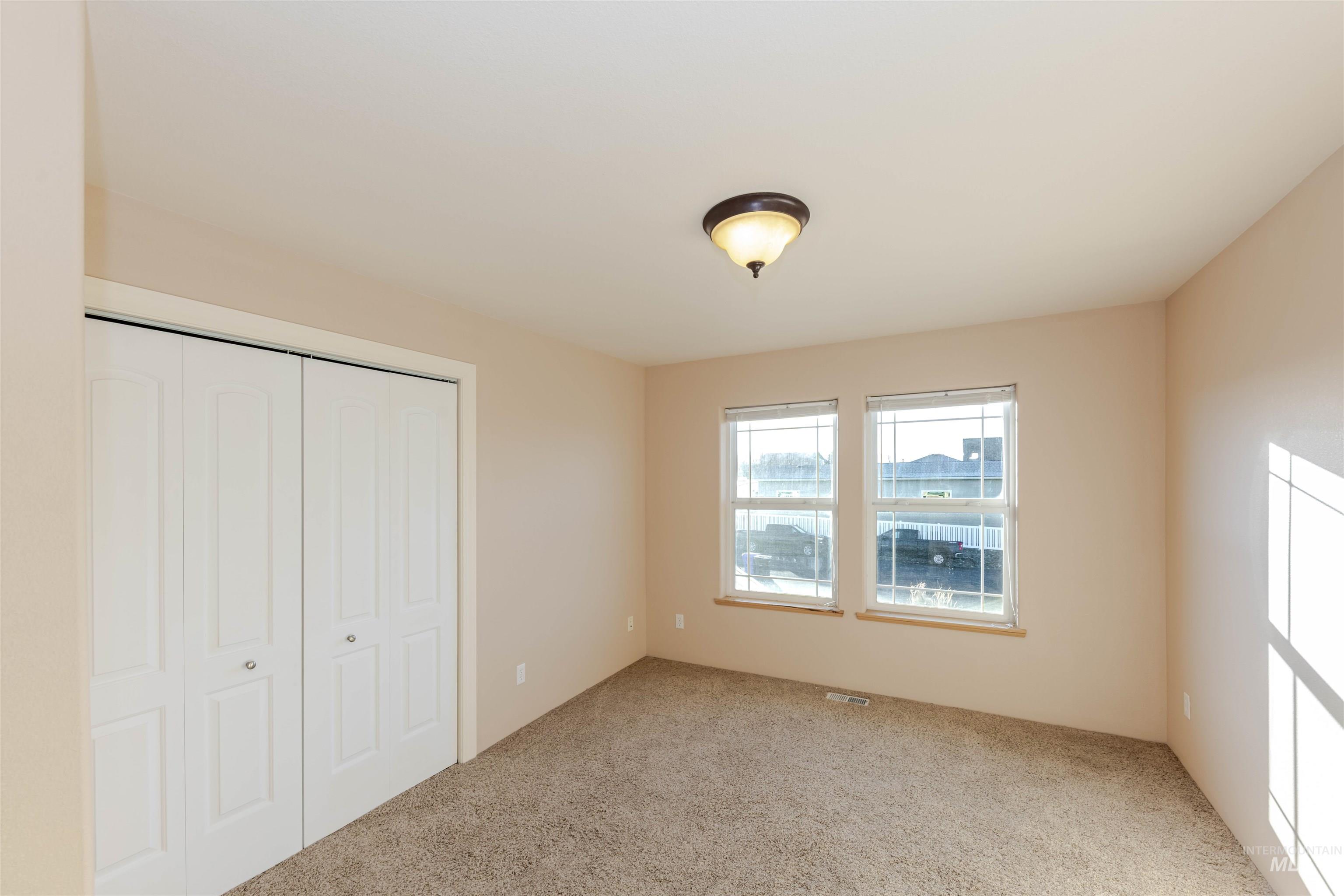 7591 Pheasant Chase Drive Lewiston, ID 83501 - Photo 16 of 32 Unfurnished bedroom featuring a closet and carpet