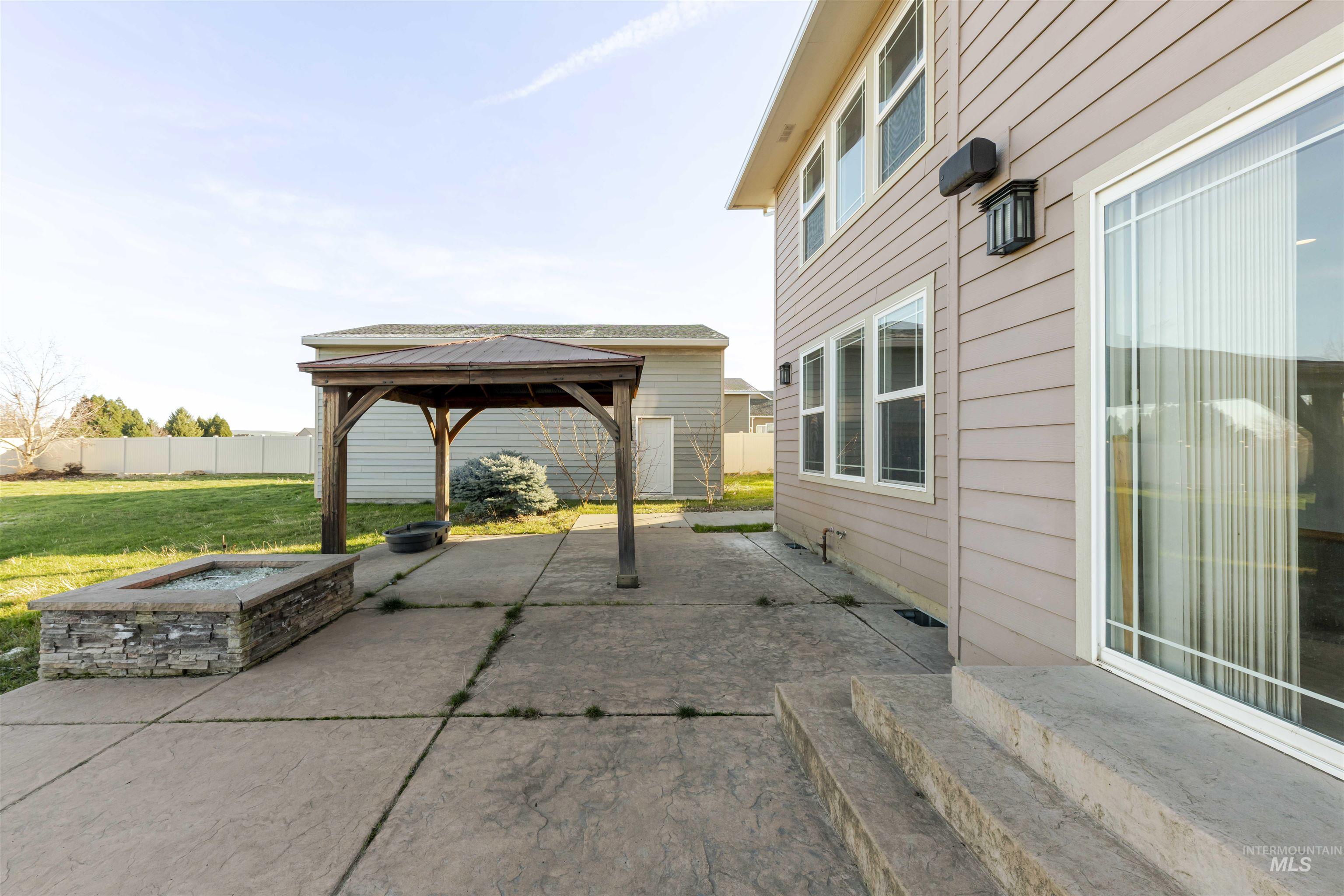 7591 Pheasant Chase Drive Lewiston, ID 83501 - Photo 27 of 32 View of patio with a gazebo and a fire pit