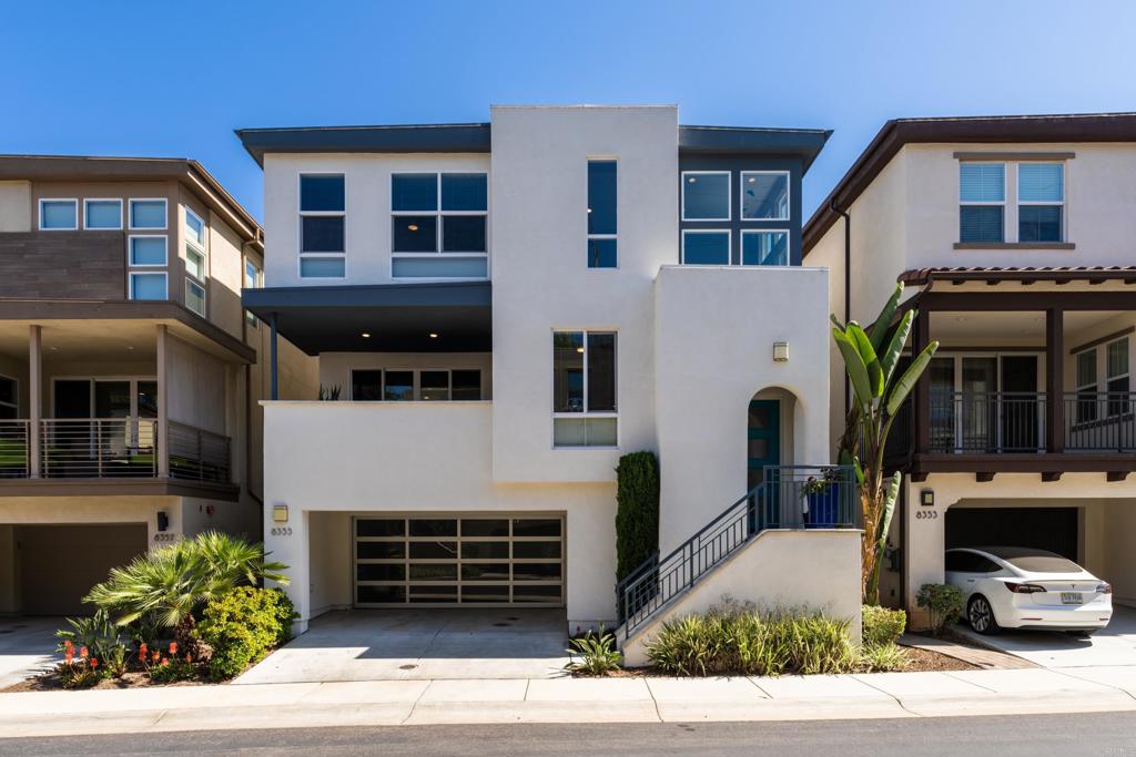 a front view of a house with garage