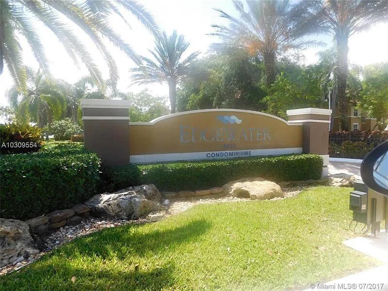 8781 Wiles Road, Unit 203 Coral Springs, FL 33067 - Photo 2 of 11 8781-Gate