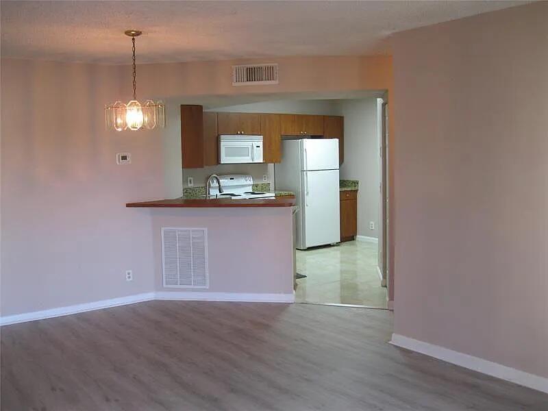 8781 Wiles Road, Unit 203 Coral Springs, FL 33067 - Photo 4 of 11 8781-Kitchen