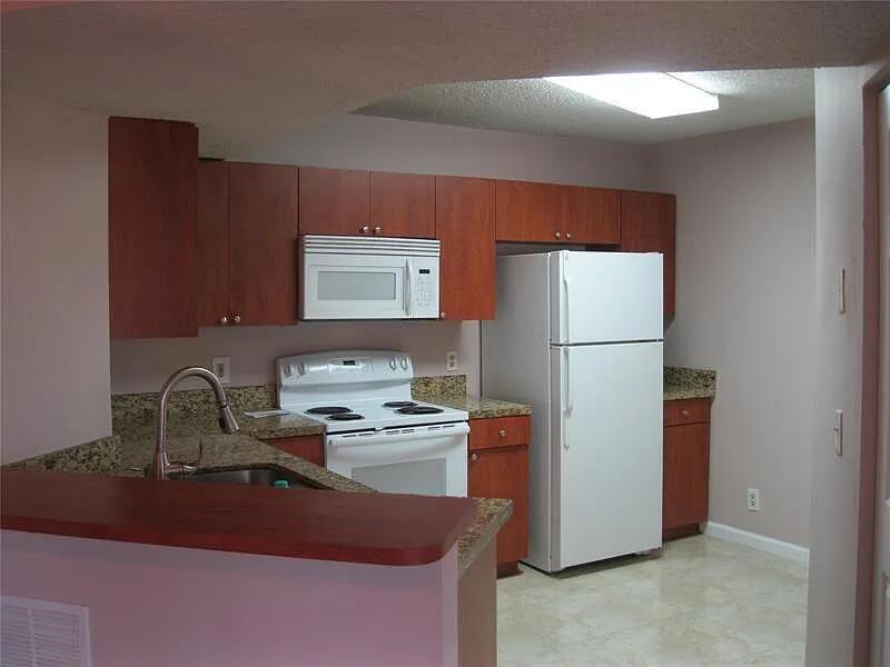 8781 Wiles Road, Unit 203 Coral Springs, FL 33067 - Photo 6 of 11 8781-Kitchen 2