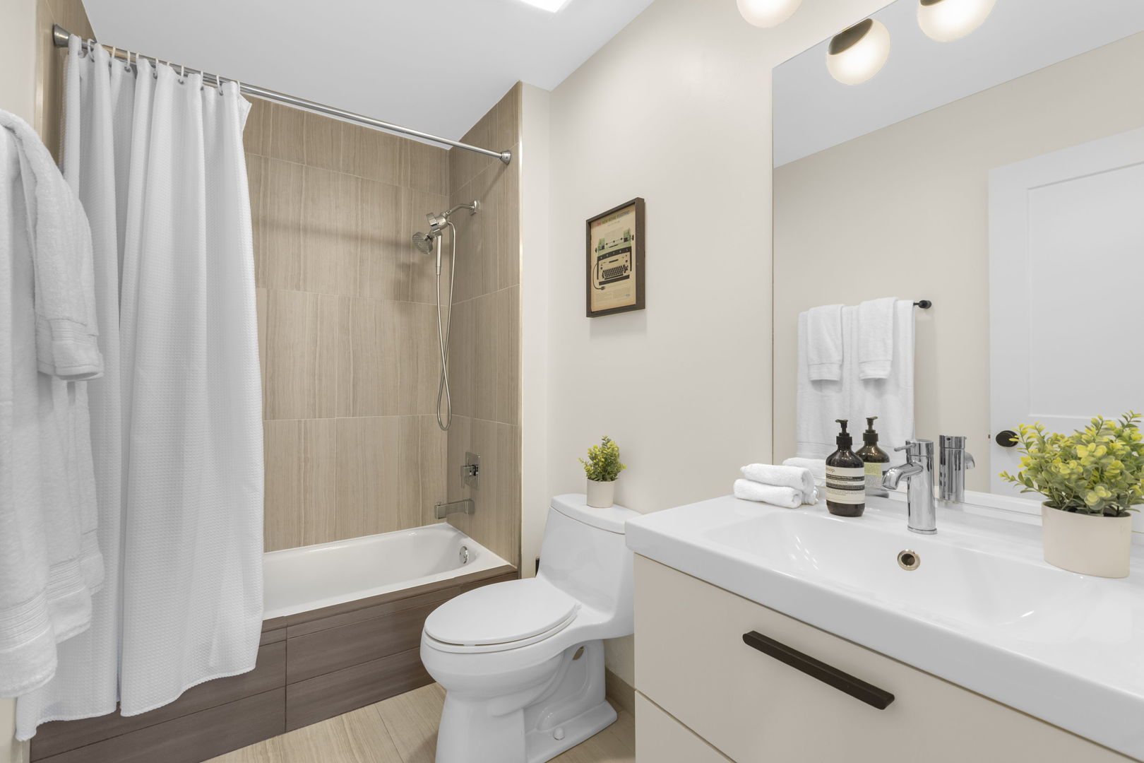 520 West Huron Street, Unit 705 Chicago, IL 60654 - Photo 11 of 14 a bathroom with a sink toilet and shower