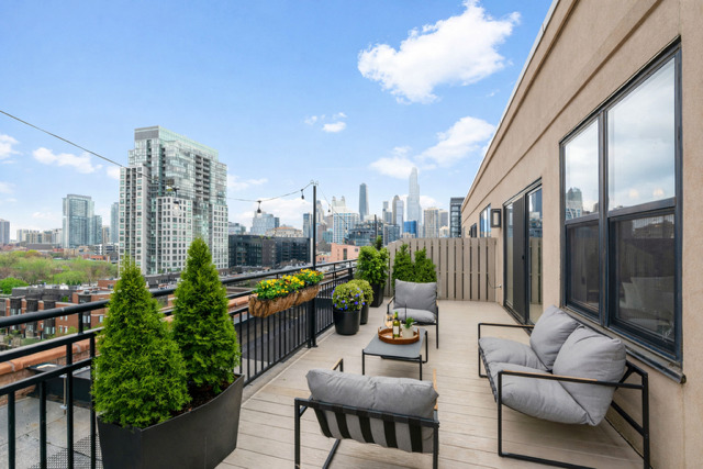 520 West Huron Street, Unit 705 Chicago, IL 60654 - Photo 12 of 14 a balcony with furniture and a view of city