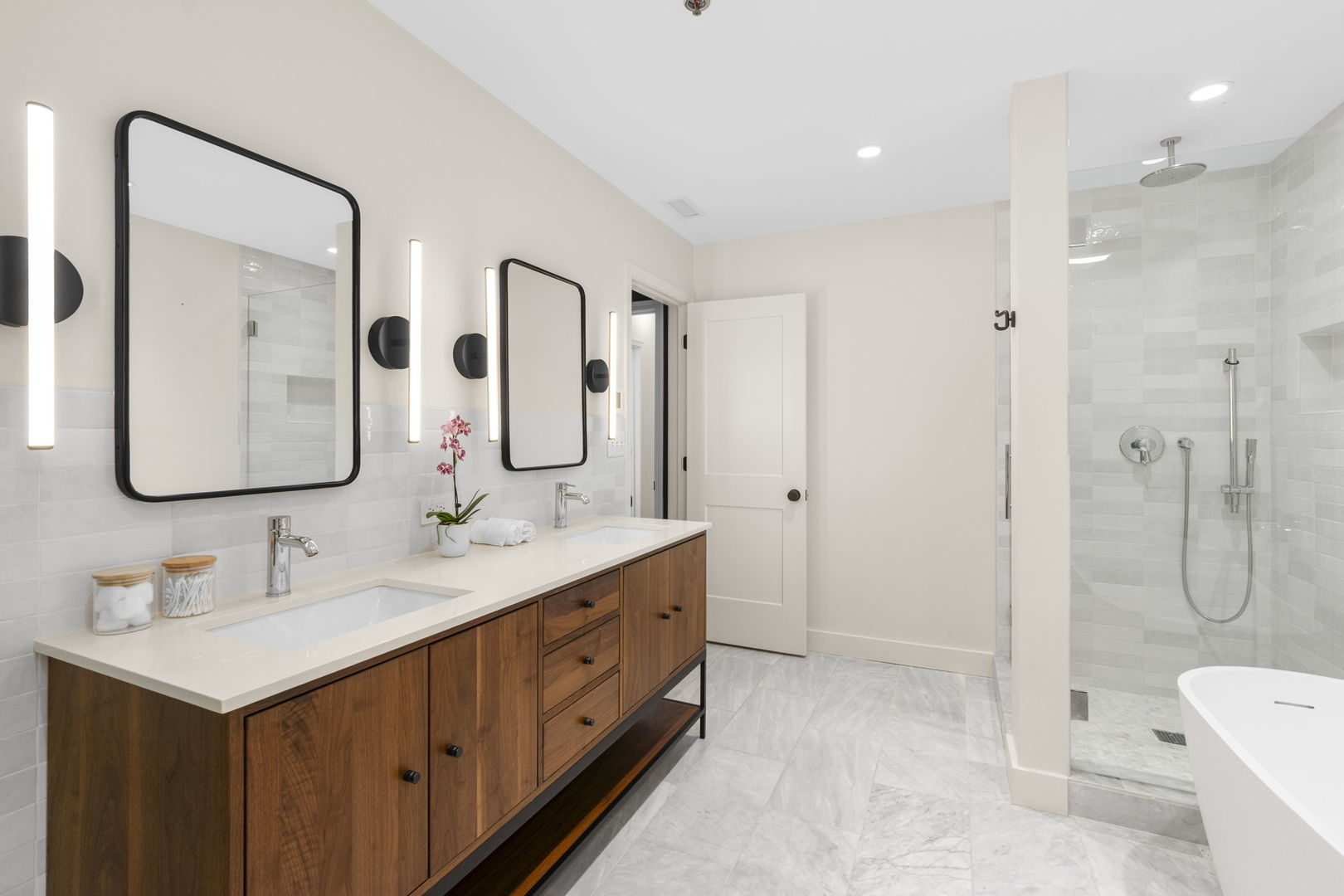 520 West Huron Street, Unit 705 Chicago, IL 60654 - Photo 9 of 14 a bathroom with a double vanity sink mirror double and shower